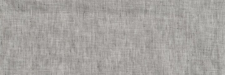 Fototapeta premium Textile fabric with a simple design in light gray color on a flat surface for use in sewing and crafting projects