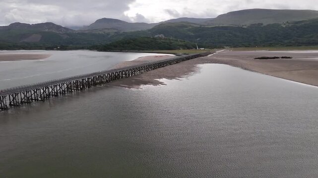 Aerial View of Barmouth Bridge and Tidal Sandbanks in Mawddach Estuary at Low Tide Wales