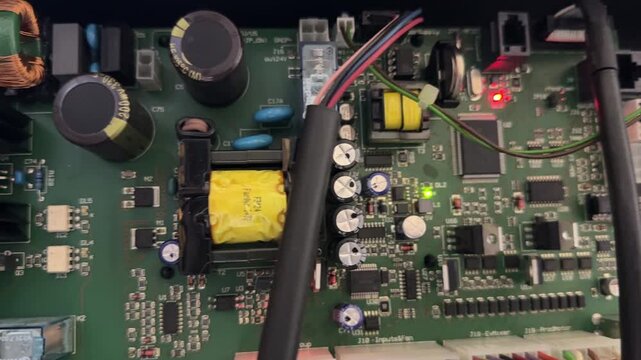 close up of electronic circuit board inside appliance, internal control system and hardware technology concept
