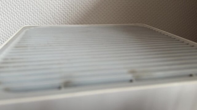 Close up of air purifier top grille, modern home appliance for clean indoor air concept