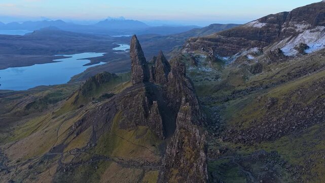 Majestic aerial footage orbiting the old man of storr, a famous rock pinnacle on the isle of skye with breathtaking scottish highlands scenery