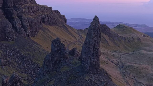 Majestic aerial view of the old man of storr, a famous rock formation on the isle of skye, scotland, during a beautiful purple sunrise
