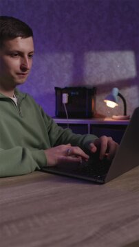 Freelancer working at night using portable backup power station