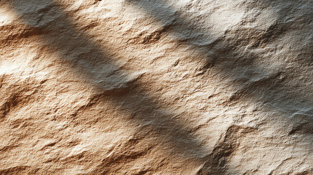 Close-up of a textured surface with natural patterns and shadows creating depth and visual interest.