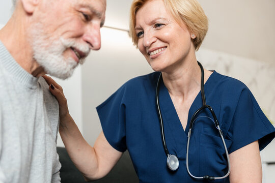 Doctor visits senior patient at home for health consultation and support