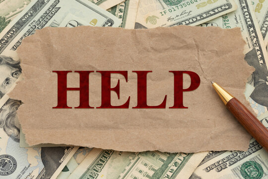 Help message on torn paper over money