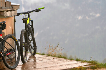 Naklejka premium Cycling in the Dolomite Alps on a rainy day