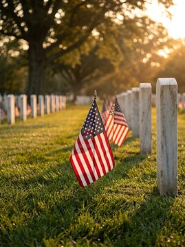 Rows of American flags and tombstones in a cemetery at golden hour, symbolizing memorial and respect.