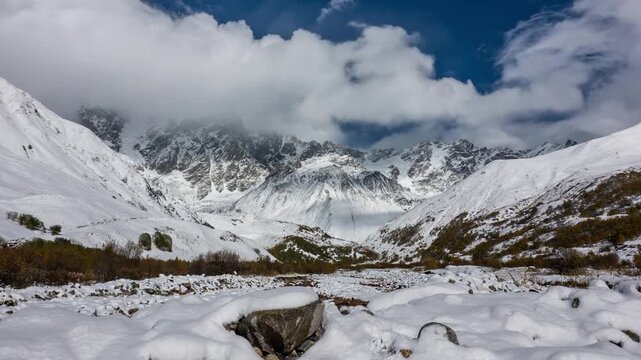 Dramatic Clouds Moving Over Snowy Caucasus Mountains in Winter Timelapse