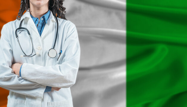 Medical professional on Ivory Coast flag. Healthcare and wellness in Ivory Coast, Concept