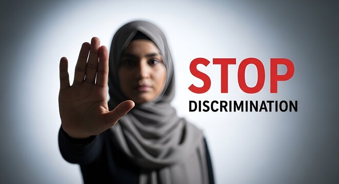 Woman in Hijab Raises Hand with STOP Discrimination Text