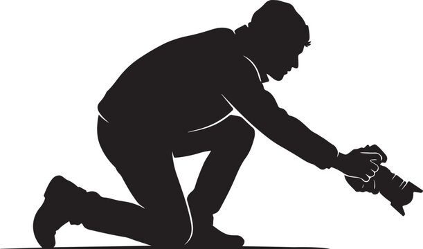 Side view silhouette of a professional photographer kneeling and taking a low angle shot with a DSLR camera isolated on white background
