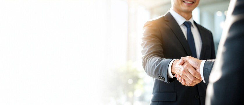 Business handshake: Captured in a moment of mutual respect and agreement, two professionals seal a deal with a firm handshake, symbolizing partnership. This image captures collaboration and success.