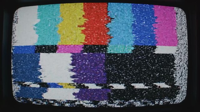 This captures a static television screen showing a test pattern with a black background, illustrating a loss of signal or transmission error on an old TV set.