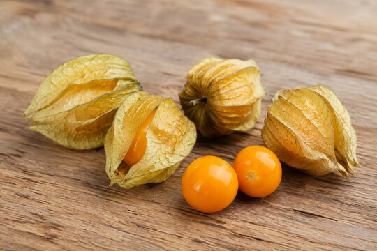 Physalis berry on wooden background