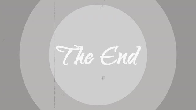 A classic old movie ending title card animation showcases retro cursive typography over monochromatic concentric circles, heavily enhanced with vintage film grain, dust, and scratch overlay effects