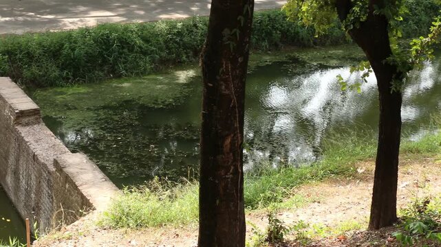 Ancient brick water gate and irrigation canal system in Sukhothai Historical Park, UNESCO World Heritage site, Thailand.