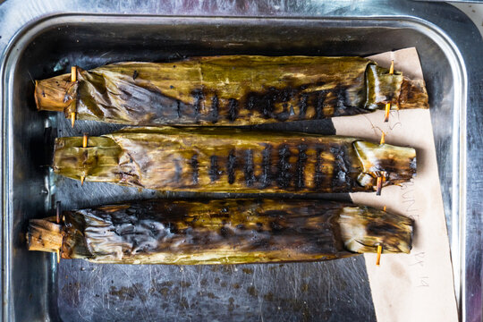 Pepes Ikan, Indonesian dish with Steamed mackerel wrapped in banana leaves with aromatic Indonesian herbs and spices.