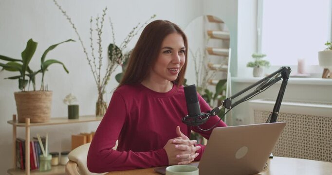 Woman streaming live podcast show at home studio
