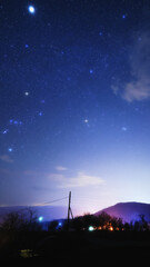 Fototapeta premium Constellations, zodiacal light and Milky Way stars on a dark countryside skies.