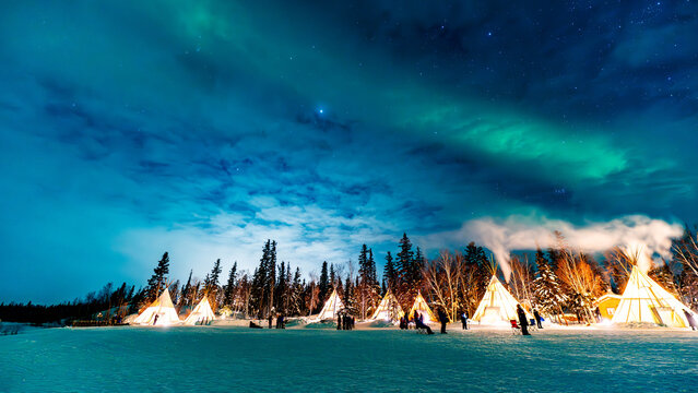 Aurora Glow Through Clouds Over Yellowknife