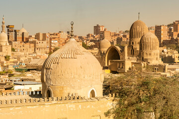 View of old buildings and domes in Cairo during sunset highlighting the architectural features of the city © denklim