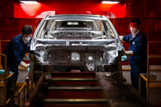   workers are building car production lines.