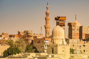 Fototapeta premium Cityscape of Cairo with historic buildings and a clear sky showing the beauty of architecture at sunset