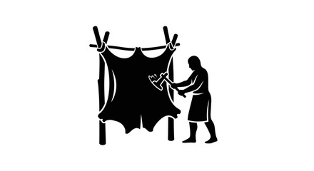 Fototapeta premium Man Hanging Up a Large Hide.