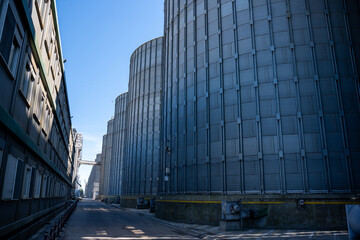 industrial grain silos and processing tower at agricultural facility © Amatis Art