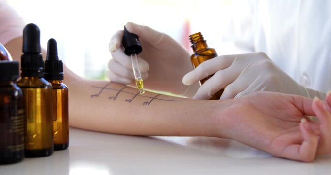 Medical professional applying allergy skin test drops on a patient&rsquo;s arm in a clinic, representing allergy diagnosis, dermatology, healthcare testing, immunology, and medical examination.