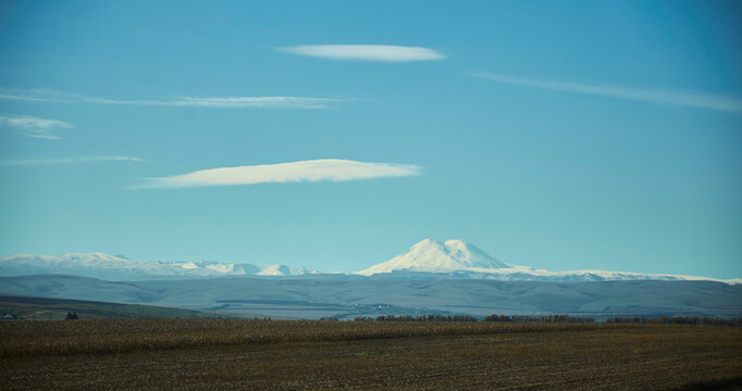 Dawn and fog. In the distance are the Caucasus Mountains, Mount Elbrus.