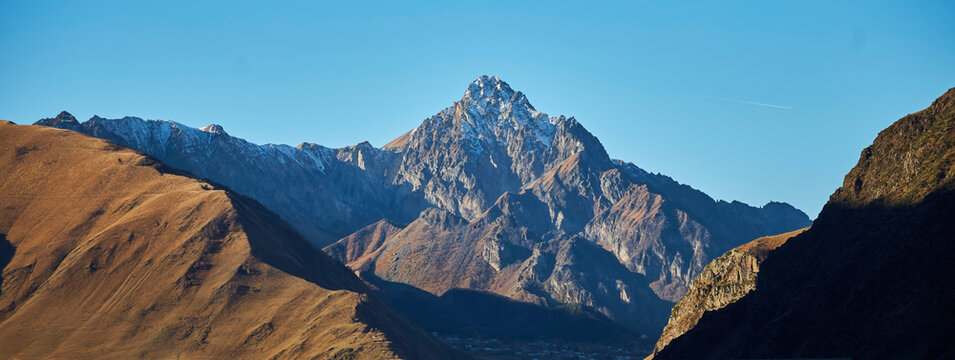 The landscape of a high mountain in Georgia. View from the village of Stepantsminda.