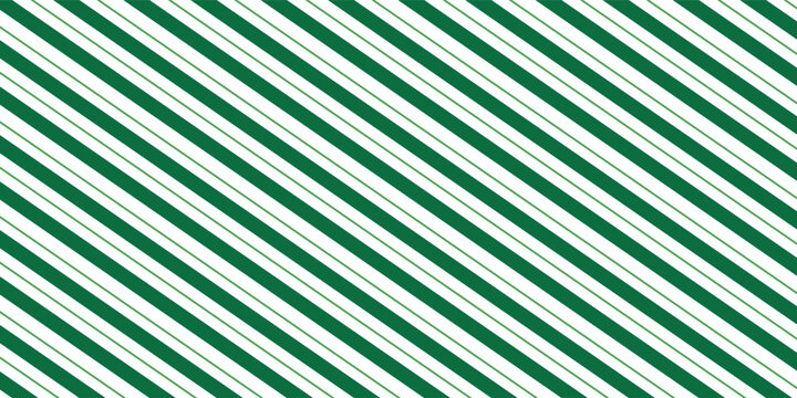 Christmas seamless pattern. Red and green diagonal stripes background. Candy cane repeating decoration wallpaper. Winter holiday lines backdrop. Xmas peppermint present wrapping print design. Vector