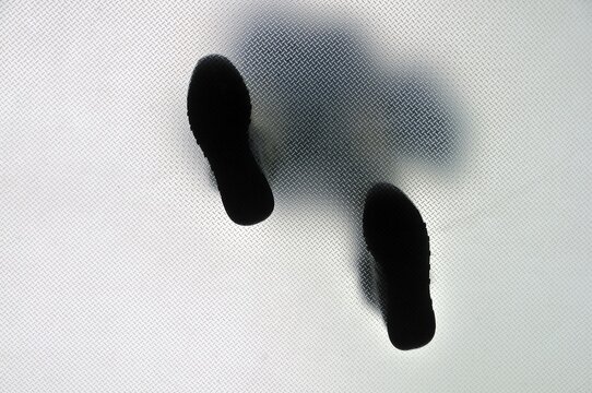 Anonymous walking person from below
