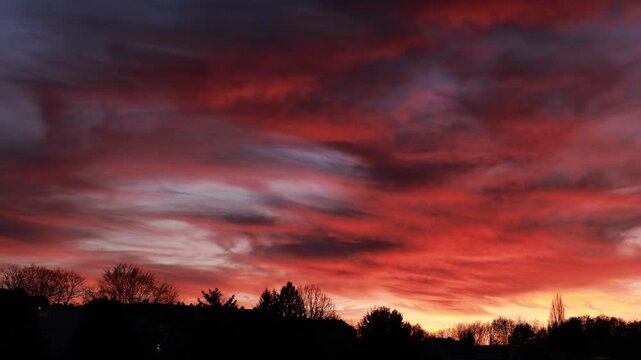 Dramatic Red Sunset Over German Town Skyline