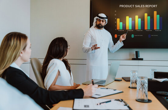 Diverse business team collaborating during presentation in meeting room