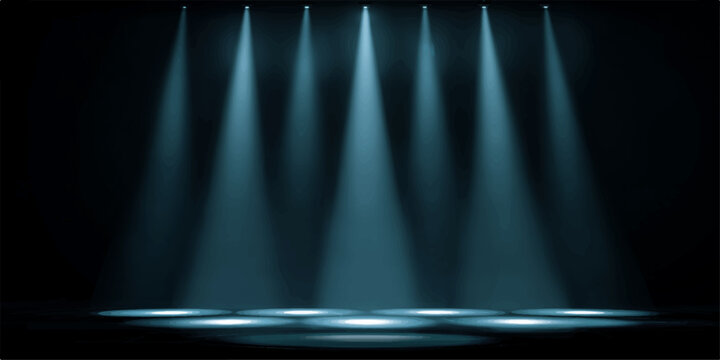 A dramatic display of eight spotlight beams converge downwards, creating a vibrant illumination over a darkened stage or area, evoking a sense of anticipation and focus.
