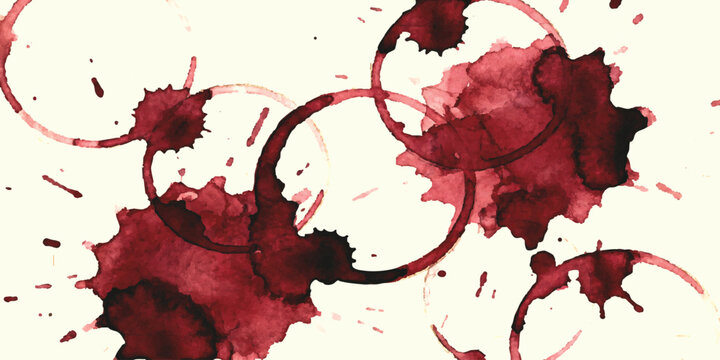Red wine glass stains and messy liquid splashes on a surface