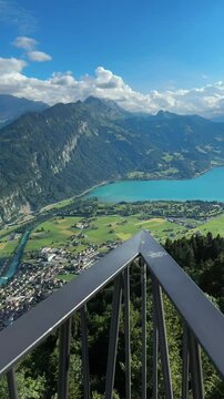Aerial view from Harder Kulm viewpoint overlooking Interlaken city and the turquoise Lake Brienz in the Swiss Alps