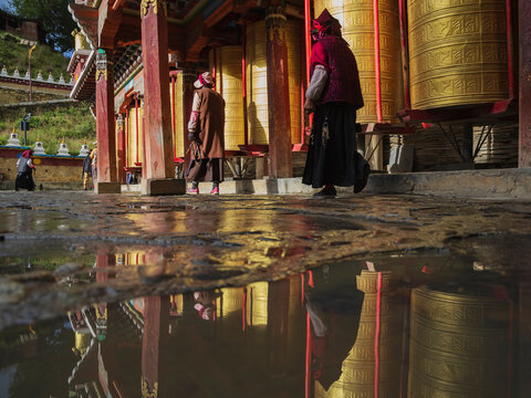 Pilgrims walking around Prayer Wheels, Tagong, Sichuan Province, Kham Tibet,