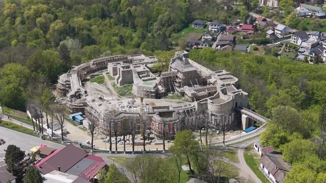 Close aerial drone view of Suceava Fortress showing detailed stone walls and inner courtyard in Suceava, Romania