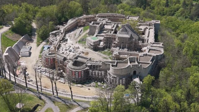 Drone aerial of Suceava Fortress under restoration with scaffolding and construction work in Suceava, Romania