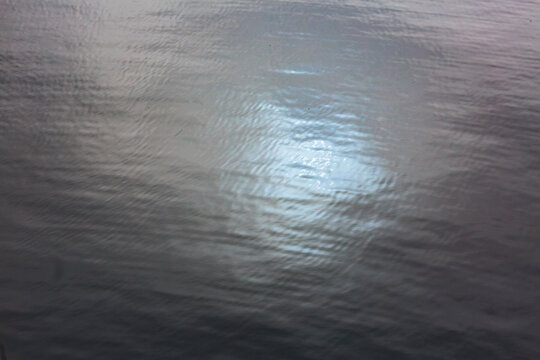Blue sky reflection on the waters of Puget Sound, in fog.