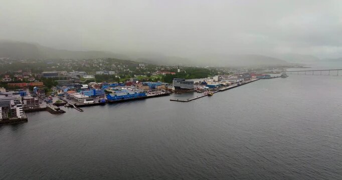 Misty aerial view of Sortland waterfront from over Sortlandsundet strait, Noway