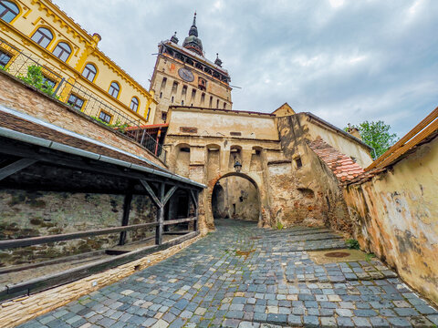 Cobblestone street leading to Clock Tower in Sighisoara citadel, birthplace of Count Dracula