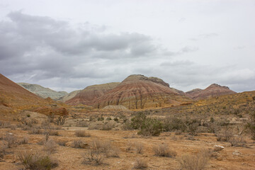 Naklejka premium Beautiful panoramic landscape of colorful layered Aktau Mountains