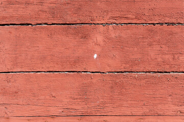 Old barn wood planks with chipped red paint © Krafla