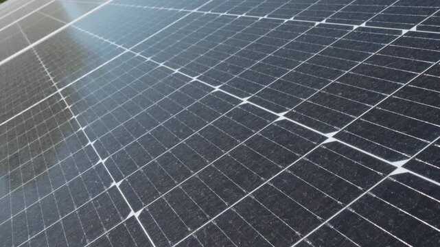 Surface of bifacial photovoltaic solar panels covered with dust and water spots. Industrial energy facility requiring professional cleaning to prevent power generation efficiency loss.