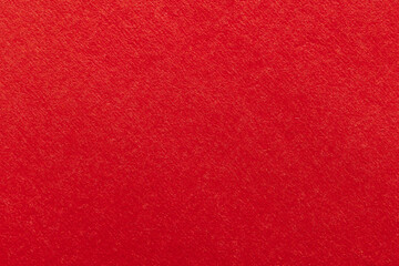 Fototapeta premium Red paper texture background,Macro,Close-up of high-quality red paper texture, perfect for backgrounds, greeting cards, and festive designs.